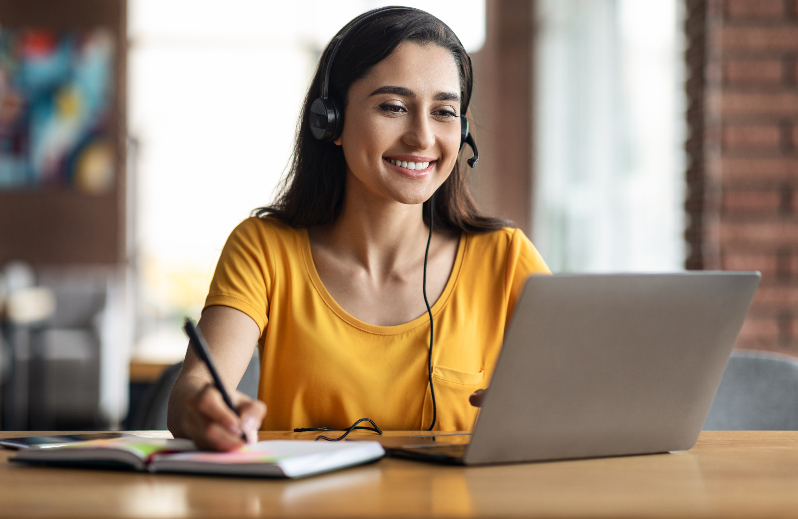 Happy young arab woman having educational course online