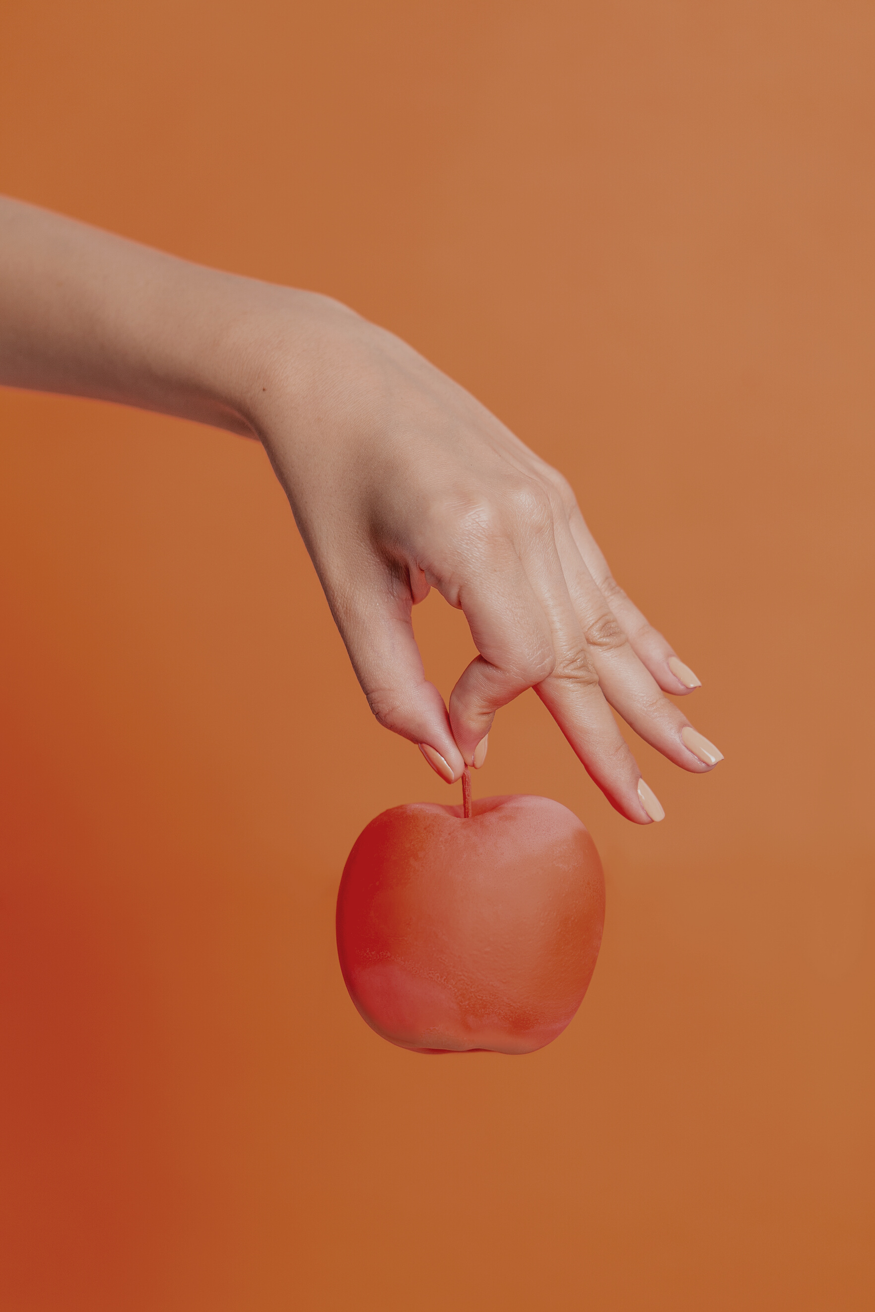 Hand Holding an Apple 